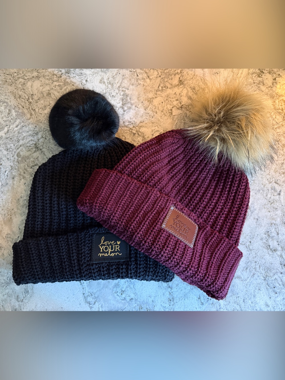 Pair of Love Your Melon Knit Beanies with Detachable Faux Fur Poms